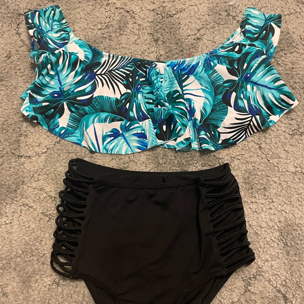 Green and blue greenery top, super high rise, black cheeky bottoms, two piece.